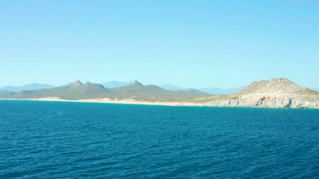 EAST CAPE BCS MEXICO-2020: Coastal View of Ocean, Sandy Shore, and Distant Mountains