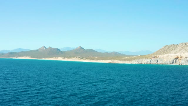 EAST CAPE BCS MEXICO-2020: Coastal Waters with Small Boats Moving near Sandy Beach