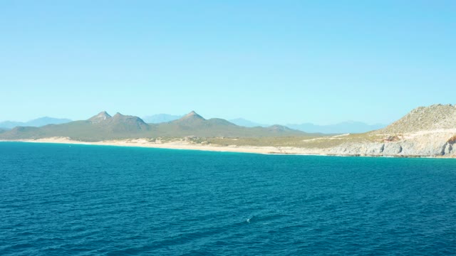 EAST CAPE BCS MEXICO-2020: Ocean Wave Near Sandy Beach and Mountains