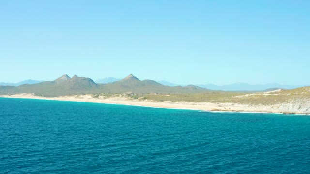 EAST CAPE BCS MEXICO-2020: Calm Ocean Meets Sandy Beach and Distant Mountains