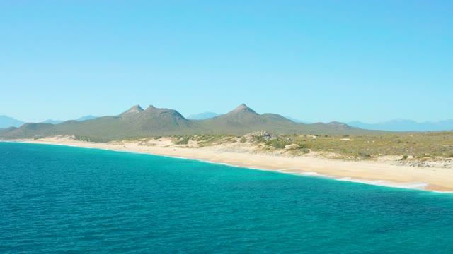 EAST CAPE BCS MEXICO-2020: Sandy Beach with Turquoise Ocean and Distant Mountains