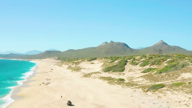 EAST CAPE BCS MEXICO-2020: Beach Dunes with Vehicle and Person Moving Along Shoreline