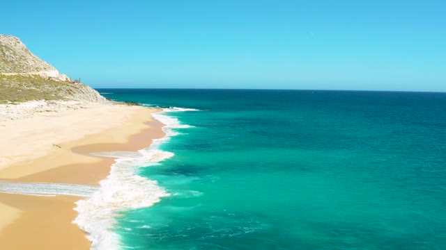 EAST CAPE BCS MEXICO-2020: Gentle Ocean Waves Washing over Sandy Shore