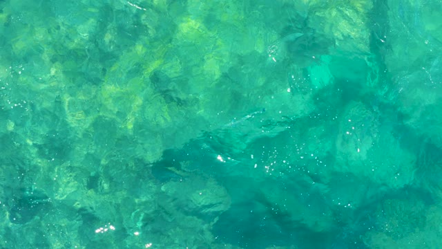Shallow Turquoise Water with Visible Underwater Rocks