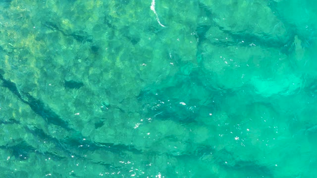 Clear Turquoise Water Over Rocky Seabed