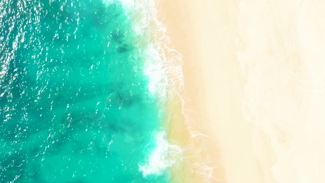 Turquoise Ocean Waves Gently Lapping Sandy Shore