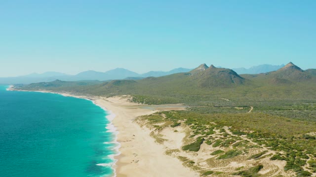 Coastal Beach and Mountainous Shoreline with Turquoise Waters
