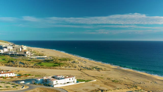 Sandy Beach and Coastal Buildings in Aerial View