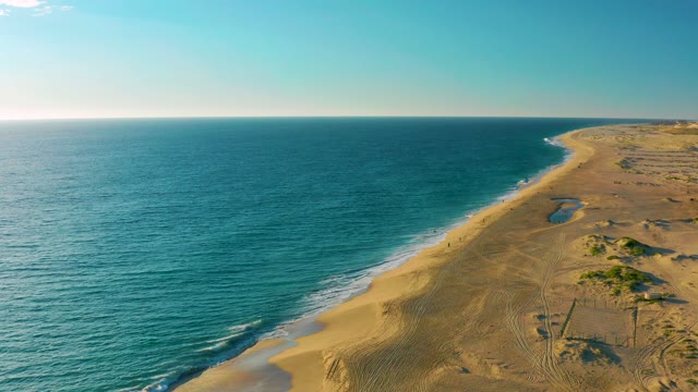Gentle Ocean Waves Lapping Sandy Shore From Above