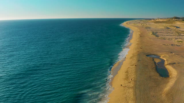 Gentle Waves Lapping Sandy Beach