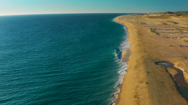 Waves Rolling Onto a Sandy Beach