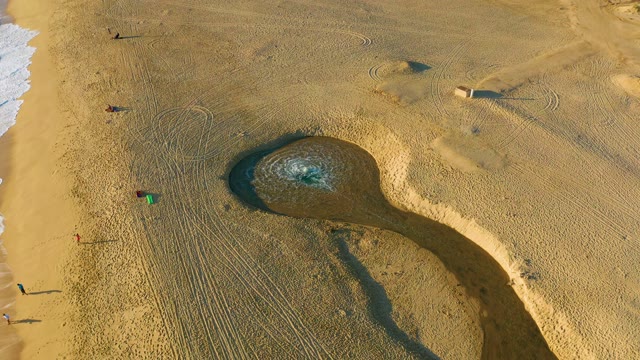 Beach Sand Structure with Water Pool and People