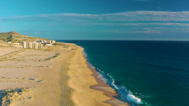 Gentle Ocean Waves Rolling Onto Sandy Shore