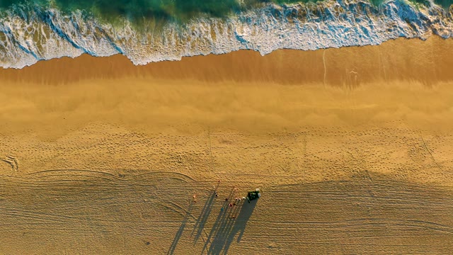 Waves Rolling In on Golden Beach