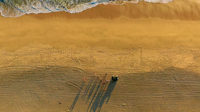 Sandy Beach with People and Vehicle, Aerial