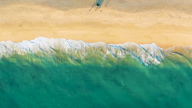 Waves Rolling Onto Shore with Small Beach Structure