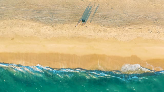 Sandy Beach and Ocean Waves From Aerial View