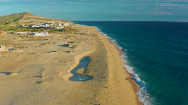 Sandy Beach and Ocean Waves From Above