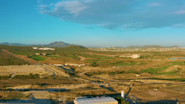 Rural Fields and Scattered Buildings Under Clear Sky
