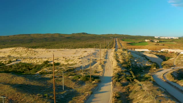 People Walking on a Winding Road From Above