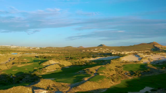 Shifting Sunlight on Rolling Hills and Green Fields