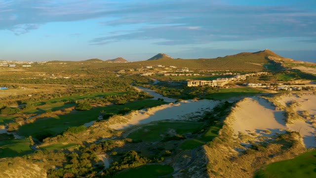River Winding Through Green Fields and Hills