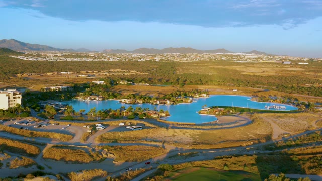 Lake in Arid Landscape with Distant Town