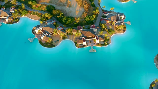 Bungalows Along Turquoise Water's Edge