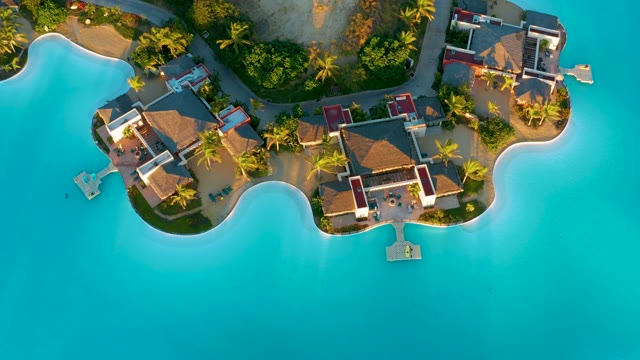 Overwater Bungalows with Thatched Roofs and Turquoise Water