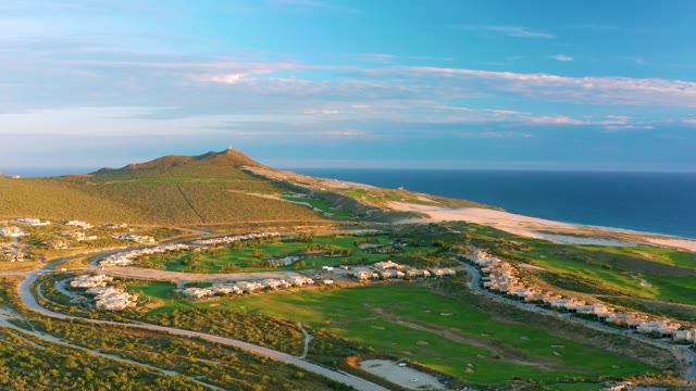 Hillside Coastal Development with Ocean and Beach