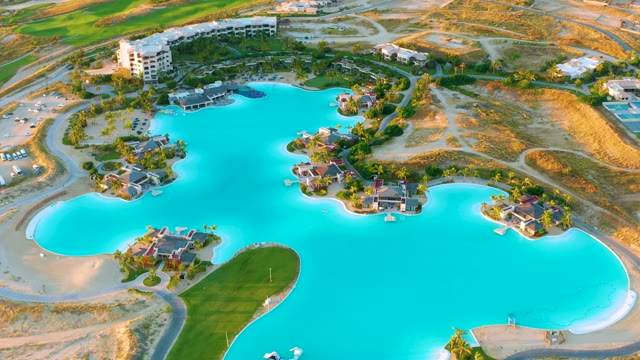 Large Turquoise Lake with Residential Development and Roads