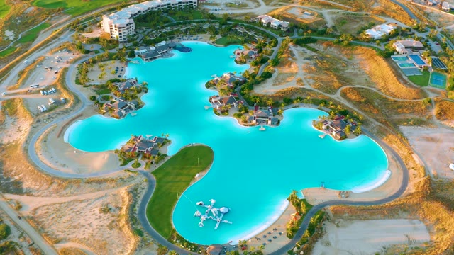 Large Blue Lagoon with Moving Vehicles on Roads