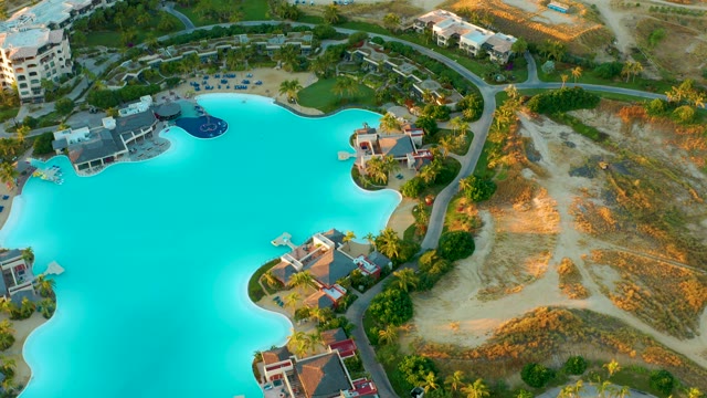 Resort Lagoon with Surrounding Buildings and Palm Trees