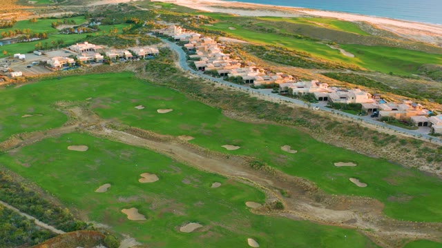 Golf Course with Sand Traps and Coastal Homes