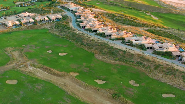 Golf Course and Coastal Homes During Aerial Flight