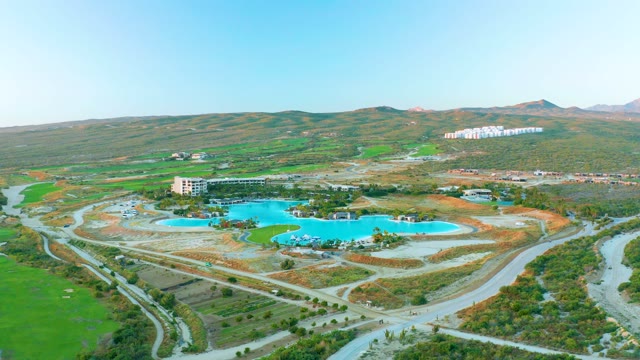Reservoir, Winding Roads, and Passing Vehicle