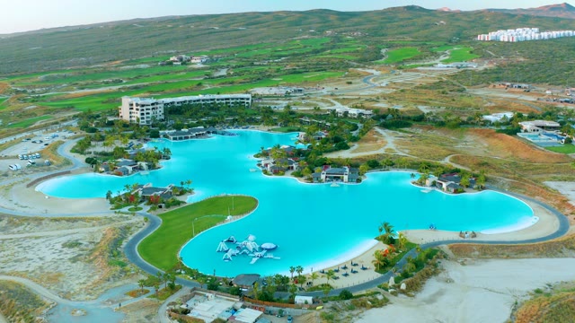Vibrant Blue Water Park Pool and Slides