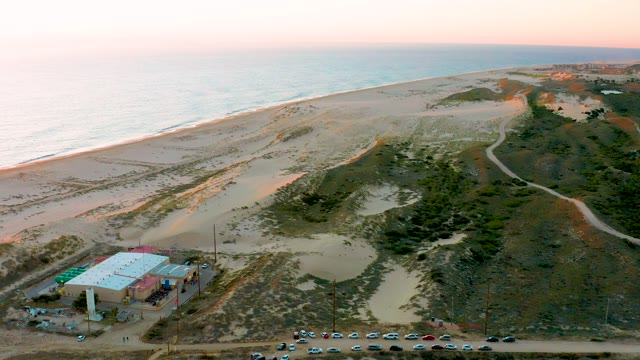 DIAMANTE CABO SAN LUCAS BCS MEXICO-2020: Beach Dunes and Building with Parking Lot Emptying