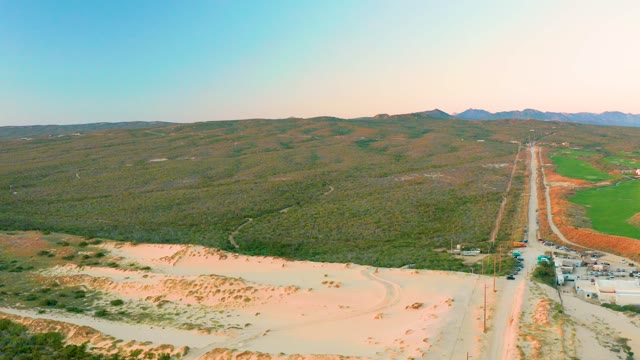 DIAMANTE CABO SAN LUCAS BCS MEXICO-2020: Vehicle Traveling on a Rural Road Through Hilly Terrain
