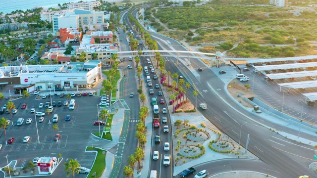 SAN JOSE DEL CABO BCS MEXICO-2020: Traffic Flow at Urban Road Intersection with Parking Lot