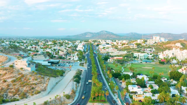 SAN JOSE DEL CABO BCS MEXICO-2020: City Highway Traffic with Mountain Backdrop