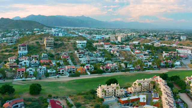 SAN JOSE DEL CABO BCS MEXICO-2020: Residential Neighborhood with Green Field and Distant Mountains