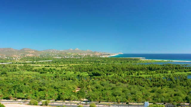 SAN JOSE DEL CABO BCS MEXICO-2020: Lush Valley and Coastal Waters with Distant Mountains