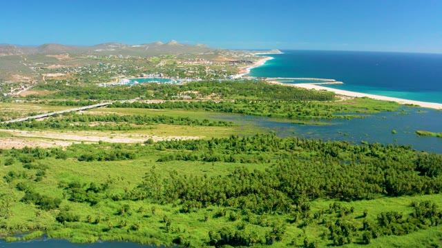 SAN JOSE DEL CABO BCS MEXICO-2020: Coastal Highway with Moving Vehicles and Green Fields