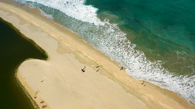 SAN JOSE DEL CABO BCS MEXICO-2020: Ocean Waves Rolling Onto Sandy Beach with People