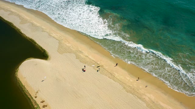 SAN JOSE DEL CABO BCS MEXICO-2020: Sandy Shore with Rolling Ocean Waves and Beachgoers