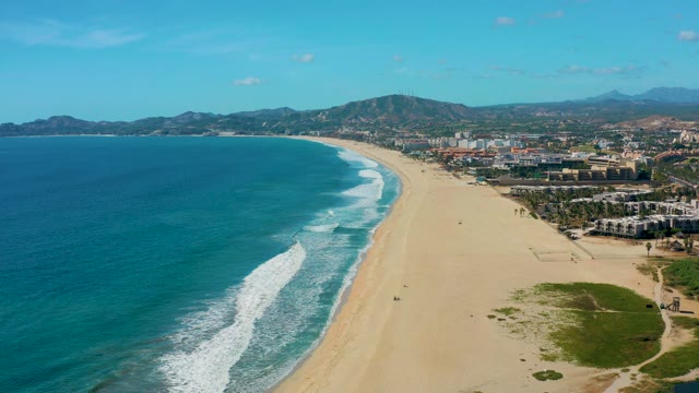 SAN JOSE DEL CABO BCS MEXICO-2020: Sandy Shoreline with Ocean Waves and Coastal Development
