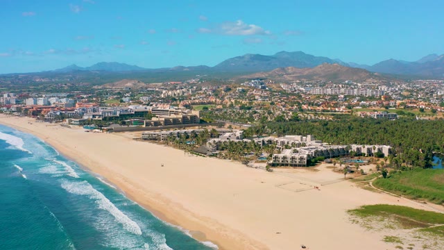 SAN JOSE DEL CABO BCS MEXICO-2020: Coastal Beach with Rolling Ocean Waves and Distant Mountains