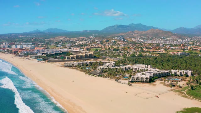 SAN JOSE DEL CABO BCS MEXICO-2020: Sandy Beach and Ocean Waves with Mountain Backdrop