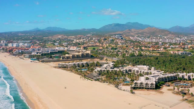 SAN JOSE DEL CABO BCS MEXICO-2020: Sandy Beach with Coastal Buildings and Moving Clouds